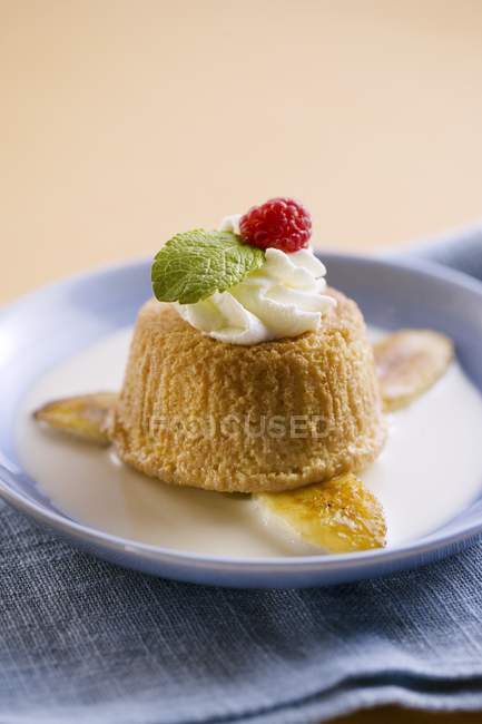 Closeup view of Tres Leches pie with whipped cream and raspberry — Stock Photo