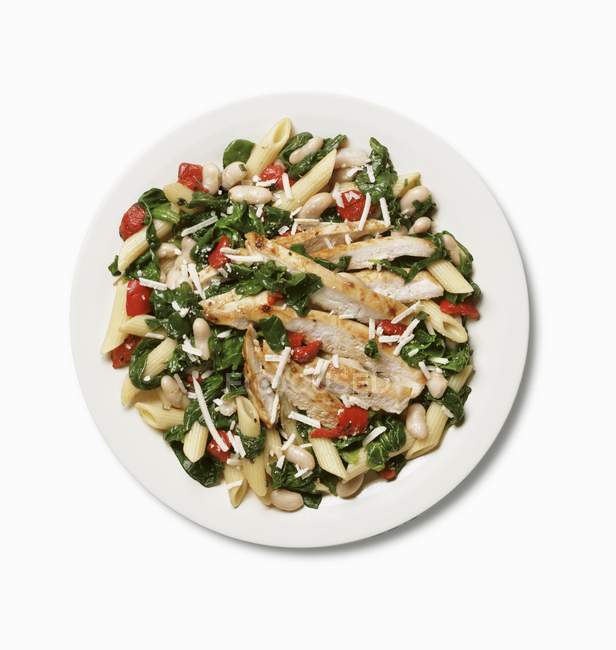 Tuscan chicken dish with pasta — Stock Photo