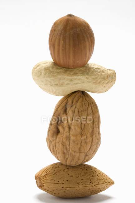 Tower of assorted raw nuts — Stock Photo