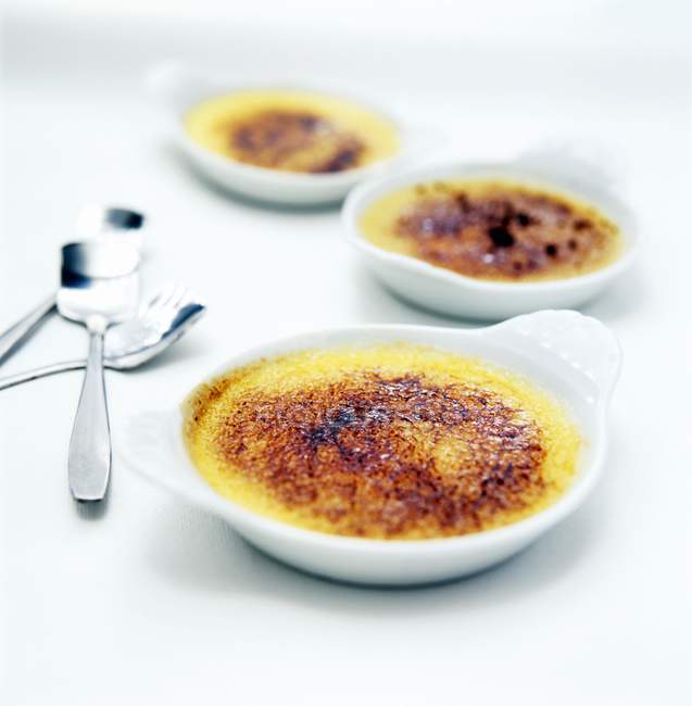 Dishes with creme brulee — Stock Photo