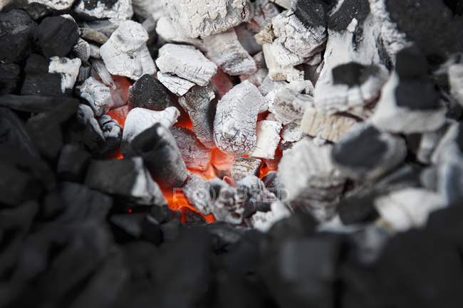 Closeup view of glowing charcoals heap — Stock Photo