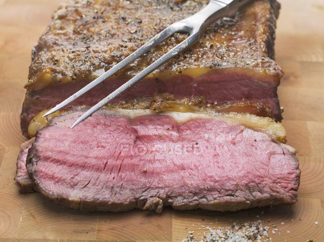 Partly sliced Roasted beef — Stock Photo