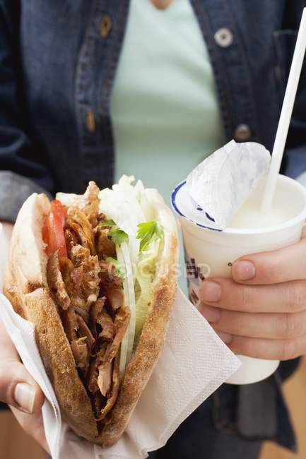 Hands holding doner — Stock Photo