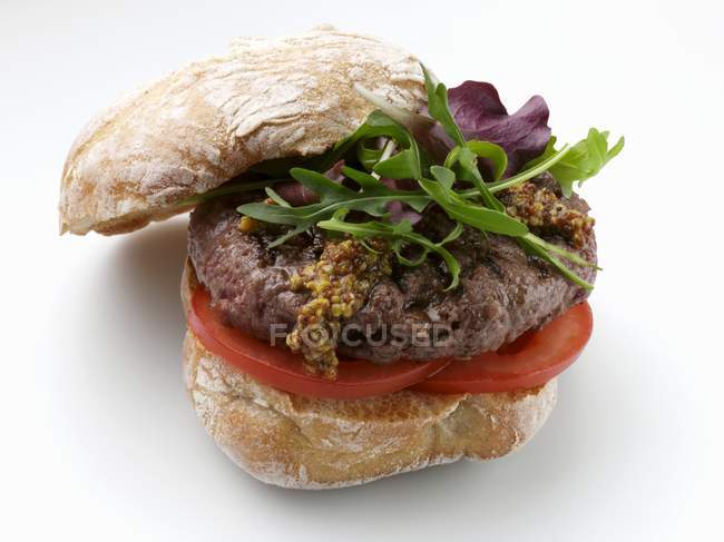 Venison burger with arugula — Stock Photo