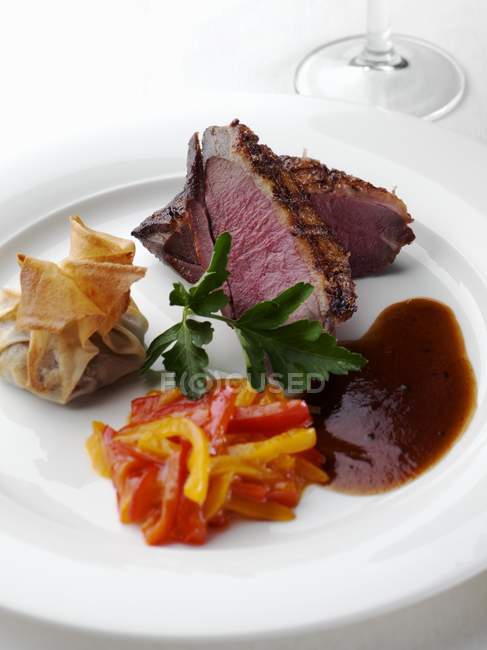Sliced Duck Breast with Dumpling and Peppers — Stock Photo