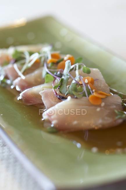Tuna sashimi in sauce — Stock Photo