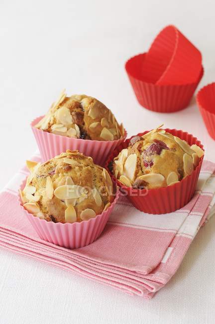 Cranberry muffins with slivered almonds — Stock Photo