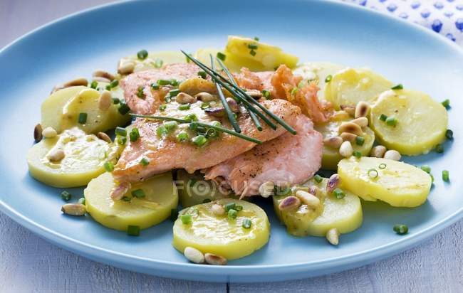 Salmon with potato salad — Stock Photo