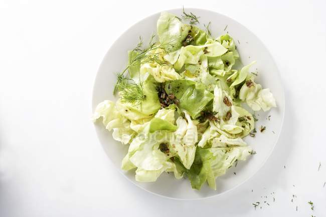 Lettuce with herb dressing — Stock Photo