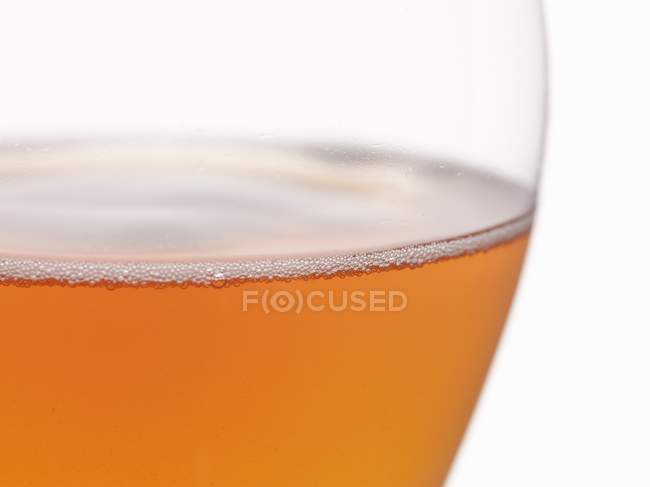 Glass of foamy cider — Stock Photo