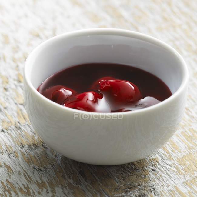 Cherry compote in bowl — Stock Photo