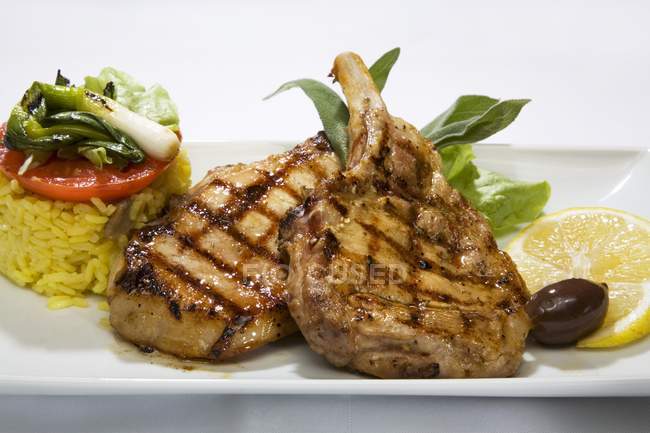 Grilled pork chops with rice — Stock Photo