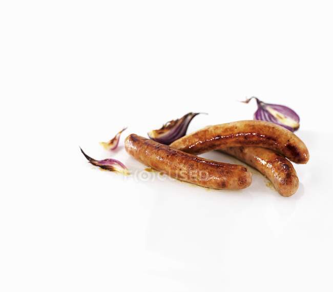 Salsichas Chipolata com cebola — Fotografia de Stock