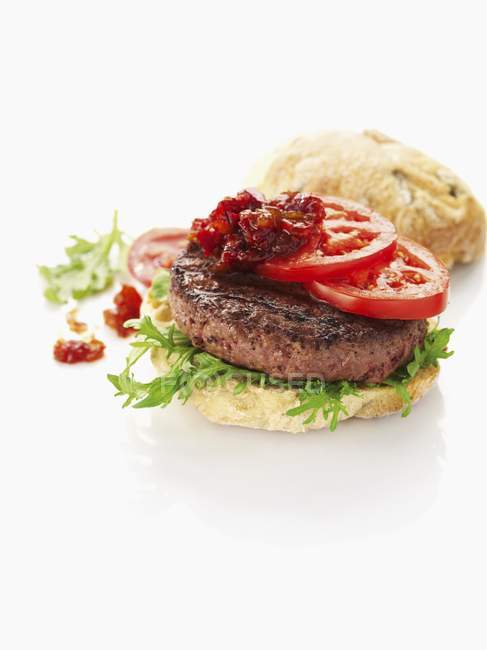 Pork hamburger with tomatoes — Stock Photo