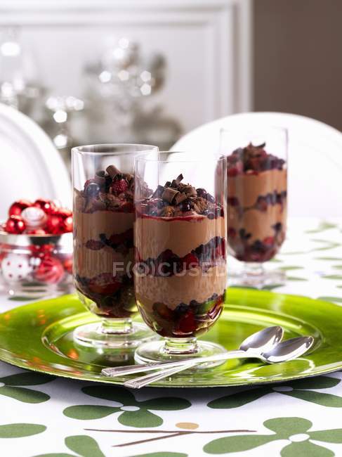 Closeup view of chocolate berry trifles in glasses — Stock Photo