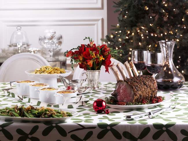 Christmas table with dishes — Stock Photo