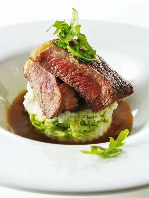Beef steak on mashed potato — Stock Photo