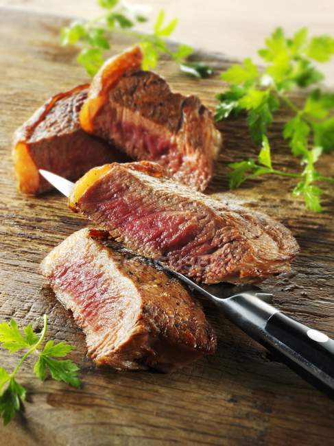 Beef steak on board — Stock Photo