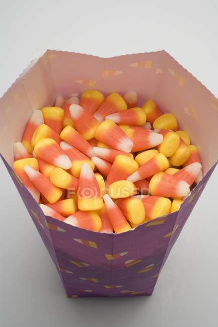 Candy corns in paper bag — Stock Photo