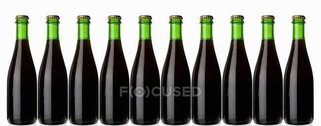 Green bottles of stout — Stock Photo