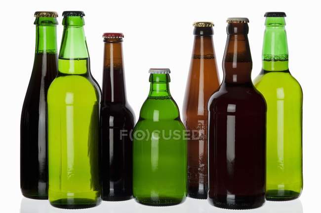 Various types of beer in bottles — Stock Photo