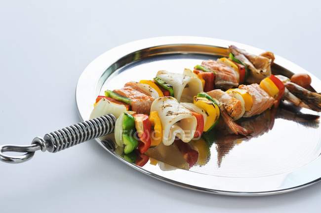 Grilled seafood and vegetable kebabs — Stock Photo