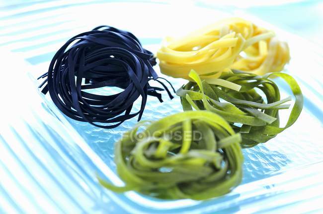Colored tagliatelle pasta — Stock Photo