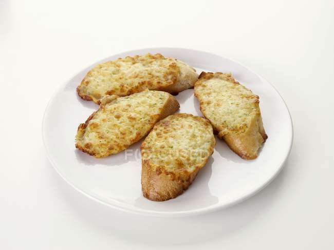 Toasted cheese on baguette slices — Stock Photo