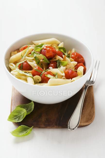 Penne pasta with cherry tomatoes — Stock Photo