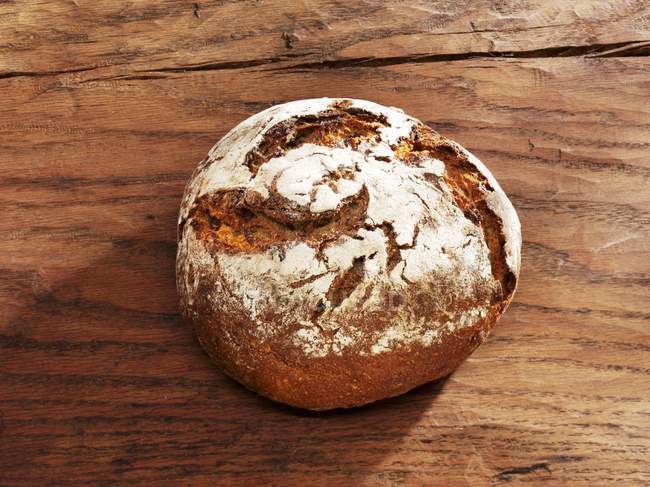 Crusty bread on wooden — Stock Photo