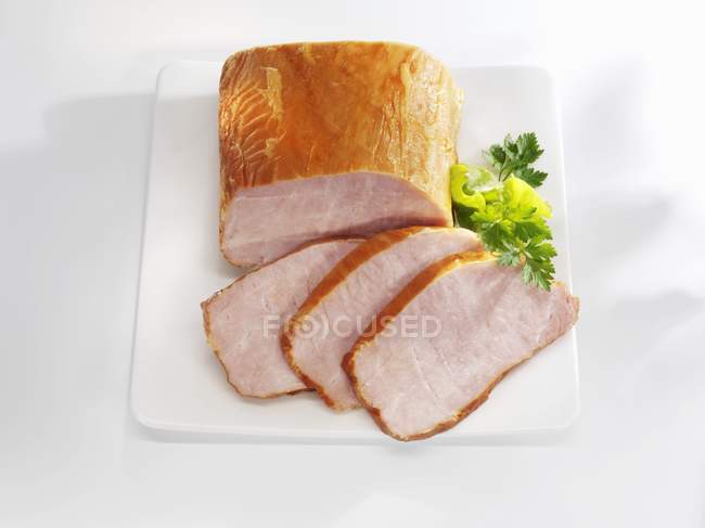 Partly sliced Smoked  loin of pork — Stock Photo