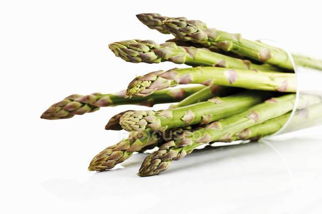 Green Asparagus in beaker — Stock Photo