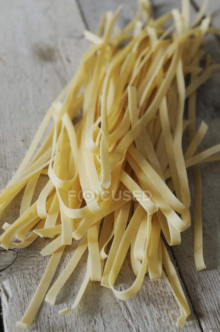 Dried homemade tagliatelle pasta — Stock Photo