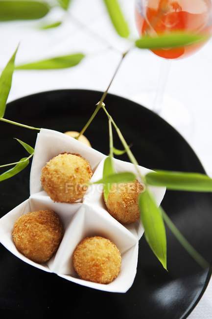 Closeup top view of fried meat balls with branch and wine — Stock Photo