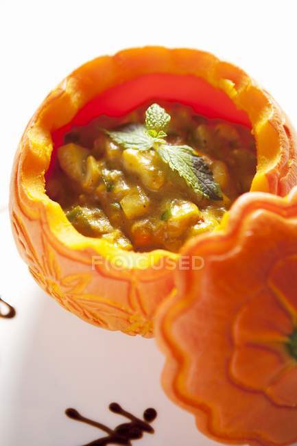 Curry Seafood Pumpkin Bowl on white surface — Stock Photo