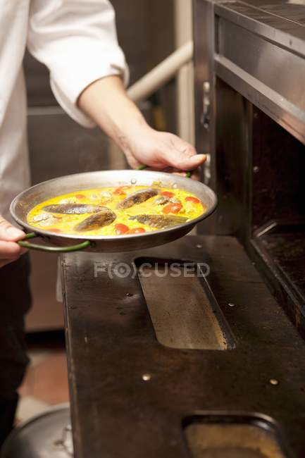Cheff putting rice dish — Stock Photo