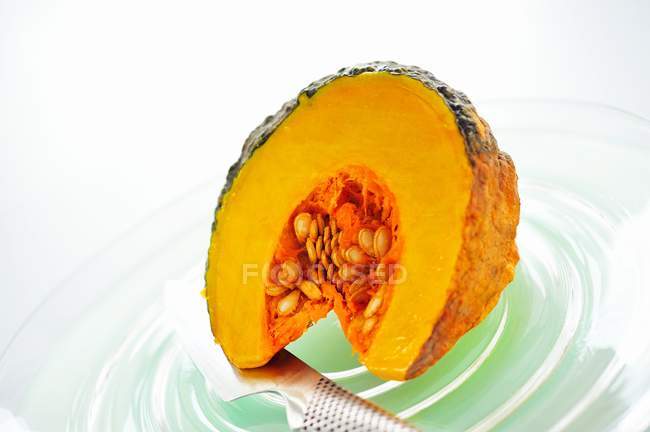 Slice of pumpkin with seeds — Stock Photo