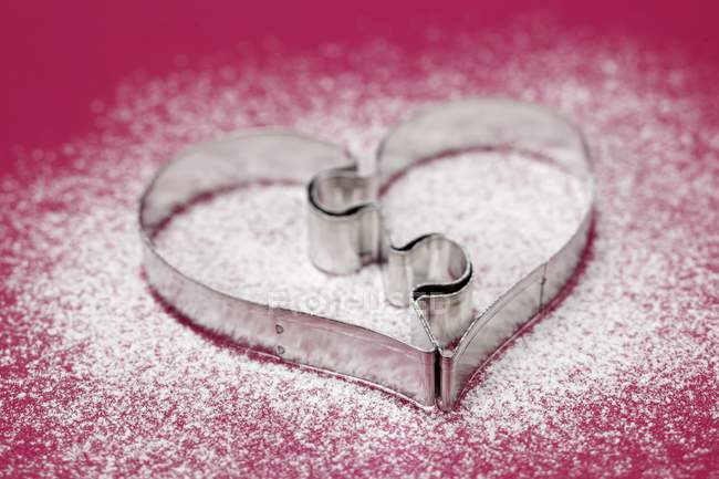 Heart-shaped biscuit cutter — Stock Photo