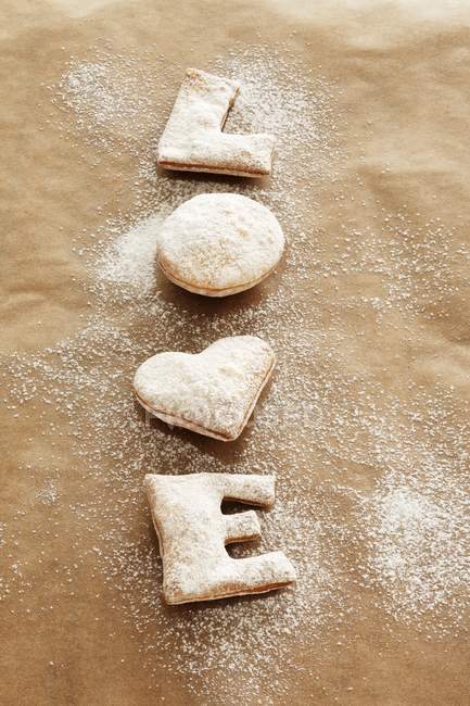 Freshly baked biscuits with icing sugar — Stock Photo