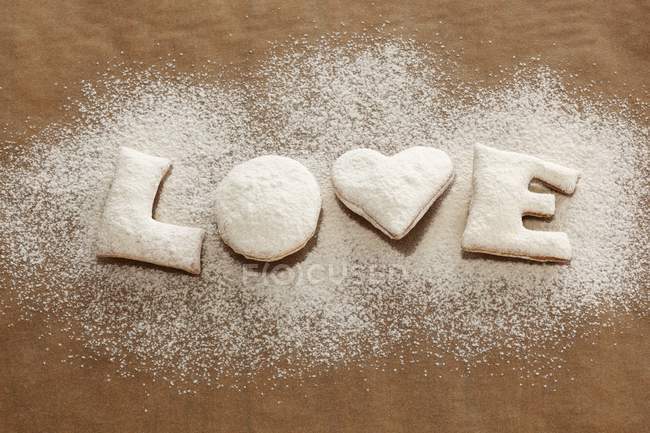 Freshly baked biscuits with icing sugar — Stock Photo
