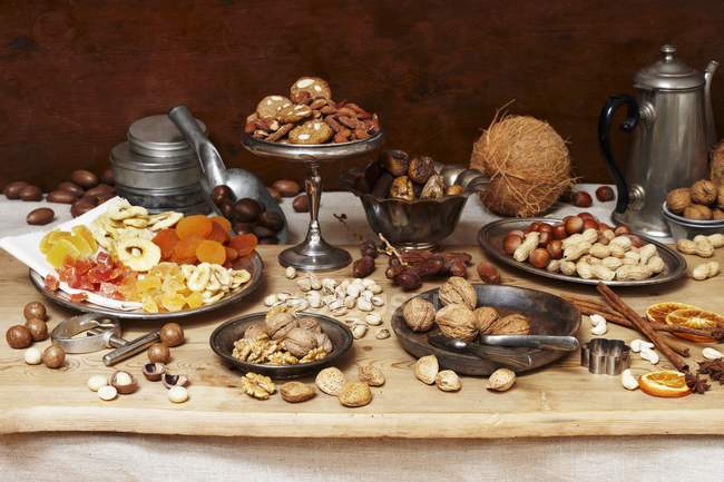 Elevated view of nut still life with dried fruit and biscuits — Stock Photo