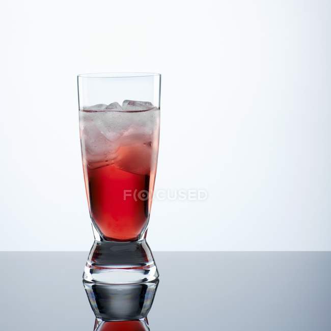 Campari with ice cubes in glass — Stock Photo