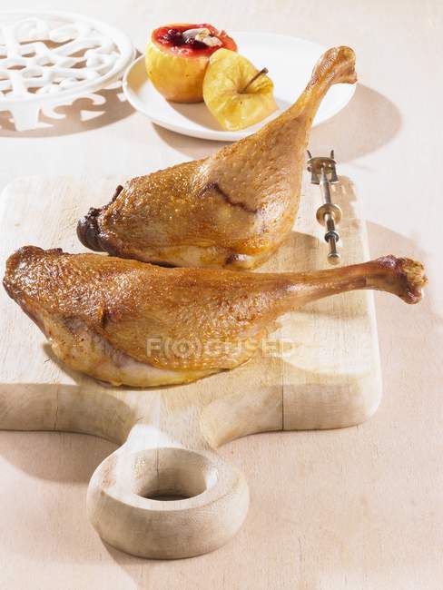 Goose legs with baked apple — Stock Photo
