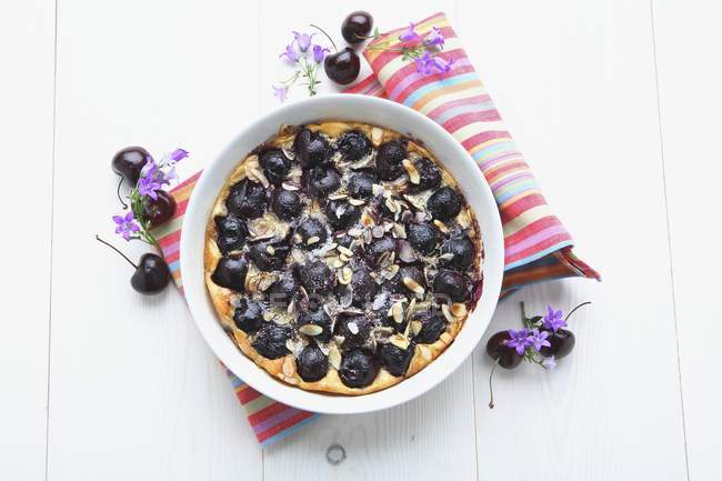 Closeup top view of Clafoutis with cherries in bowl — Stock Photo