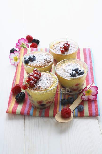 Berry pudding in four glasses — Stock Photo
