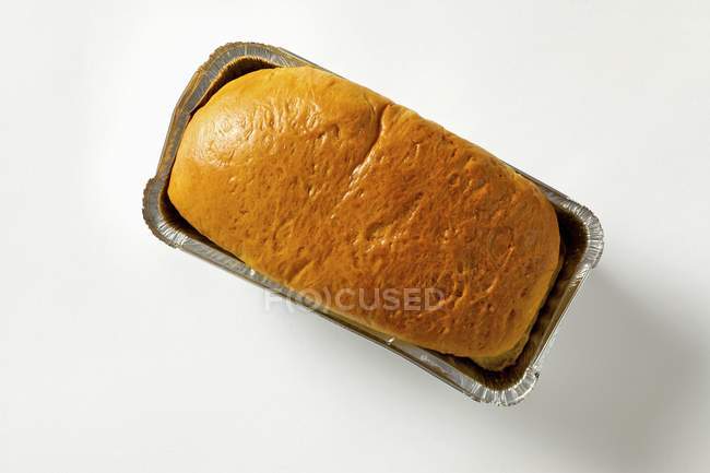 Brioche bread in aluminium baking dish — Stock Photo