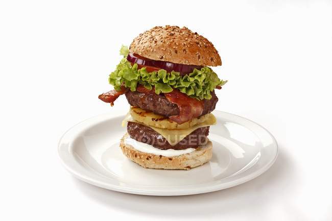 Double-decker burger with bacon — Stock Photo