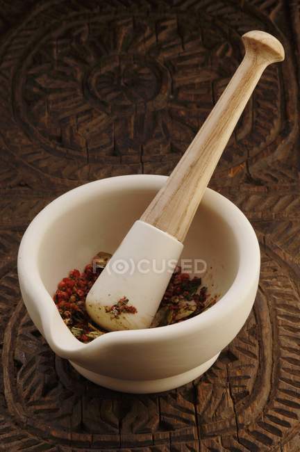 Spices in mortar with pestle — Stock Photo
