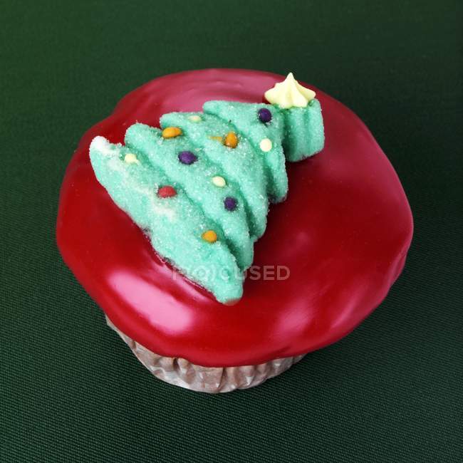 Cupcake with Christmas tree decoration — Stock Photo