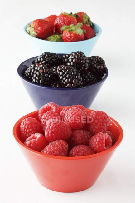 Bowls with fresh summer berries — Stock Photo